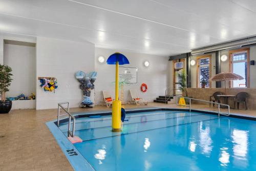 a swimming pool in a room with a swimming pool at White Point Beach Resort in Summerville Centre