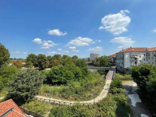 a view of a city with a bridge and trees at Casa Tina in Venaria Reale