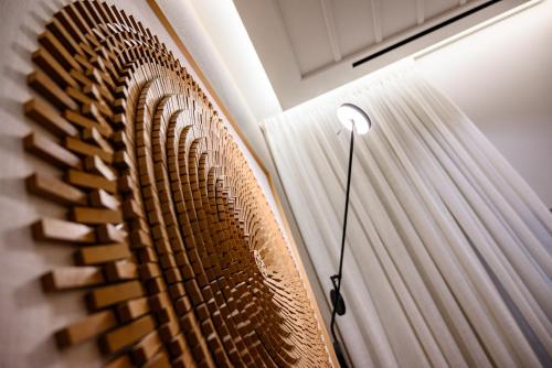a room with a fan and a curtain at STF Luxury Suites in Nafplio