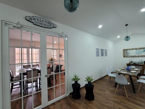 a room with a table and a dining room at Lakefront Paradise Retreat, Private Pool Vacation Home in Rivas, between Ometepe, Tola and San Juan del Sur in San Jorge