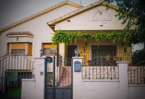 a house with a gate in front of it at Casa Rural Rincones de Albares in Albares