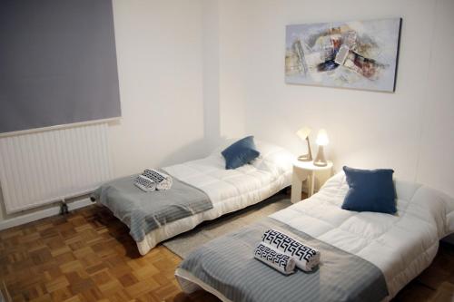 Ένα ή περισσότερα κρεβάτια σε δωμάτιο στο Elegant Apartment in Madrid 5 a 6 pax