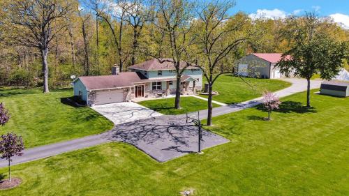 an aerial view of a house with a yard at Fowl Play Hideaway in Michigan City