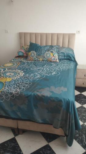 Ένα ή περισσότερα κρεβάτια σε δωμάτιο στο Appartement dar bouaaza tamaris