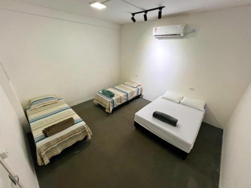 Ένα ή περισσότερα κρεβάτια σε δωμάτιο στο Pousada Dos Viajantes Economy