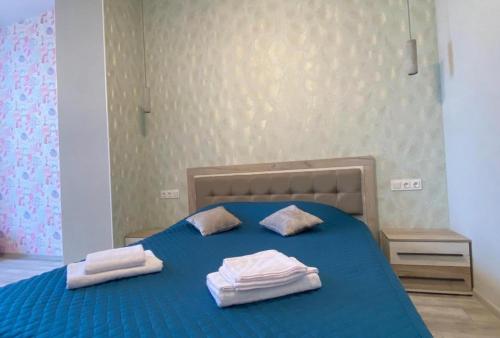 Ένα ή περισσότερα κρεβάτια σε δωμάτιο στο MAGNIT Apartments у самого моря