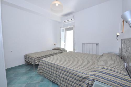 Katil atau katil-katil dalam bilik di Residence del Mare