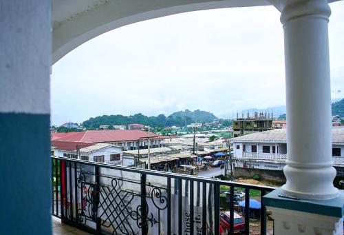 a balcony with a view of a city with buildings at Hopeland Apartments Limbe in Limbe