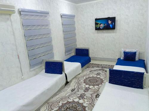 Postel nebo postele na pokoji v ubytování Olimxon Guest House