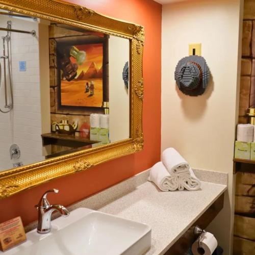 a bathroom with a sink and a mirror at LEGOLAND California Hotel and Castle Hotel in Carlsbad