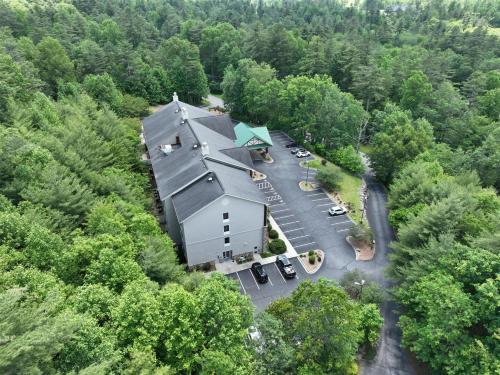 an aerial view of a large building in the middle of a forest at Hampton Inn & Suites Cashiers - Sapphire Valley in Sapphire