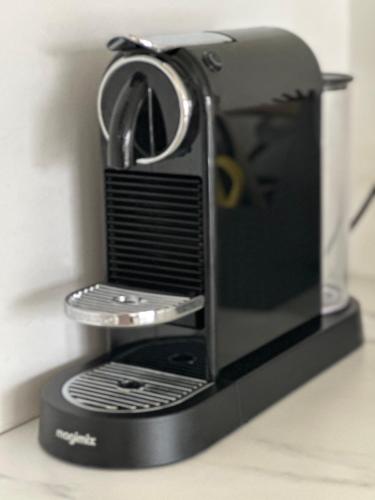 a toaster oven with its door open on a counter at Domum in Dilsen-Stokkem