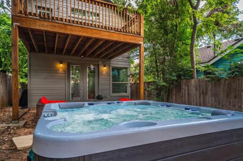 a hot tub in the backyard of a house at Austin Retreat Hot Tub and Relaxing Patio in Austin