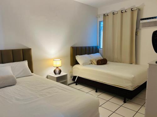 Postel nebo postele na pokoji v ubytování Flat Comfort Boa Viagem