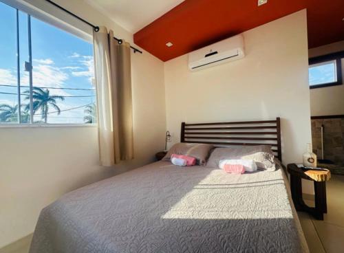 En eller flere senge i et værelse på Flat Buziano