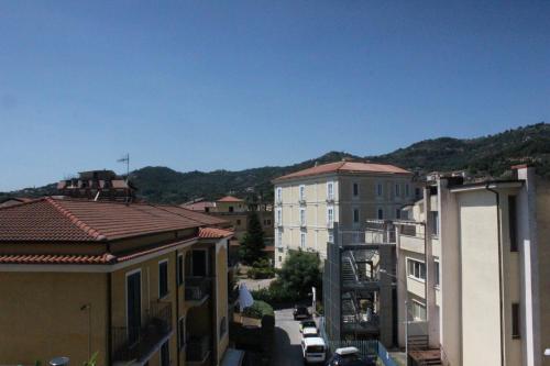 an aerial view of a city with buildings and mountains at Mar Art Sapri in Sapri