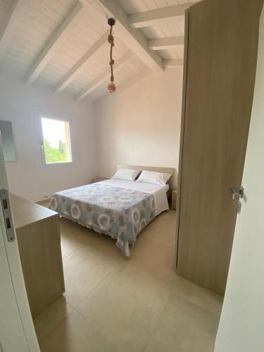 Ένα ή περισσότερα κρεβάτια σε δωμάτιο στο Casa il Melograno