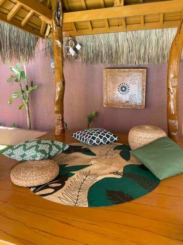 a room with a bed with pillows on it at Nelson villa home in Caticlan