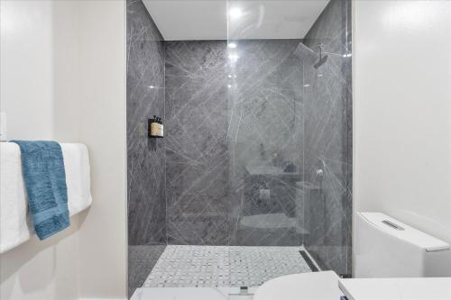 a bathroom with a shower with a glass door at Private Oasis at Arya in Miami