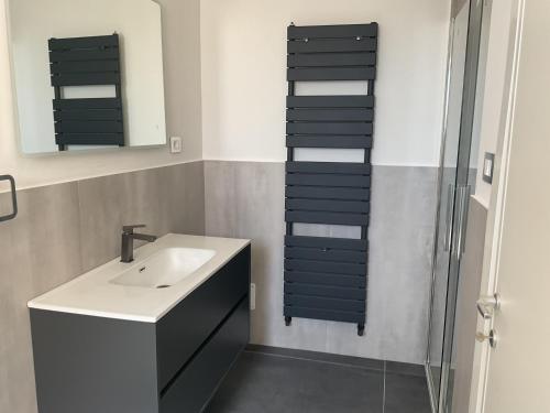 a bathroom with a sink and a glass shower at La residenza in Nardò