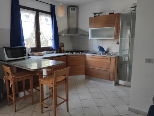 Kuchyň nebo kuchyňský kout v ubytování Soggiorno Esclusivo in Villa con Giardino