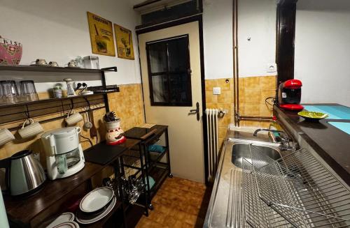 a small kitchen with a sink and a counter top at Vintage Studio - Great for Travelers in Transit in Koropíon
