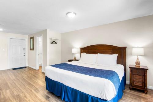 a bedroom with a large bed and a wooden floor at Coconut Cay Resort in Marathon