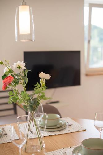 a vase with flowers in it on a table at Schön hier in Wehr
