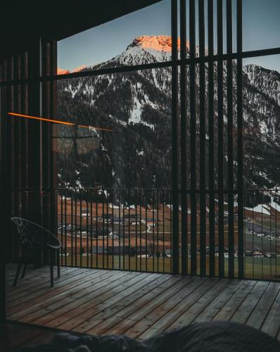 a room with a view of a mountain at Mountain Residence Montana in Santa Maddalena in Casies