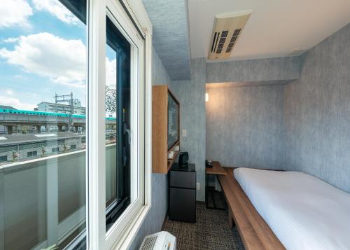 Katil atau katil-katil dalam bilik di Tabist TOKYO CITY VIEW HOTEL