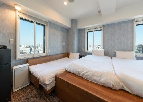 Katil atau katil-katil dalam bilik di Tabist TOKYO CITY VIEW HOTEL