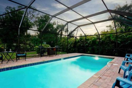 a swimming pool with a tent over it at Great Shape After Milton -gorgeous Pool! - Os in Venice