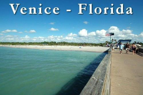 a beach with the words venice floria and people walking on it at Great Shape After Milton -gorgeous Pool! - Os in Venice