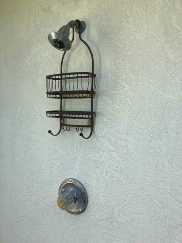 a light on a white wall with a metal holder at Great Shape After Milton -gorgeous Pool! - Os in Venice