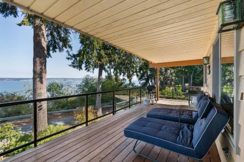 a deck with a couch and chairs on a house at 3 Bed Gorgeous Views Hot Tub Dog Friendly Ada in Langley