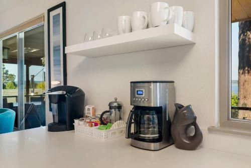 a coffee maker on a counter in a kitchen at 3 Bed Gorgeous Views Hot Tub Dog Friendly Ada in Langley