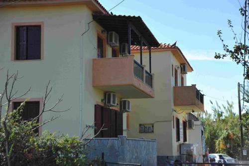 a building with balconies on the side of it at ΕΛΕΝΑ in Anaxos