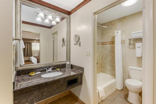 a bathroom with a sink and a toilet and a shower at Best Western Plus Greenwell Inn in Moab