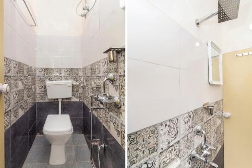 a bathroom with a toilet and a sink at Hotel O Shannu Residency in Secunderabad