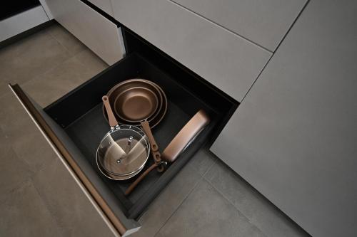 a metal object in a black drawer in a room at Plaza Rooms Luxury B&B in Pagani