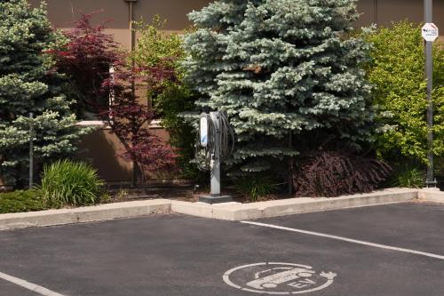 a parking lot with a handicapped sign in a parking lot at Best Western Plus Kamloops Hotel in Kamloops