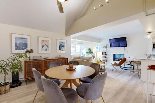 a living room with a table and chairs at Mountain Green: 2E2 in Killington