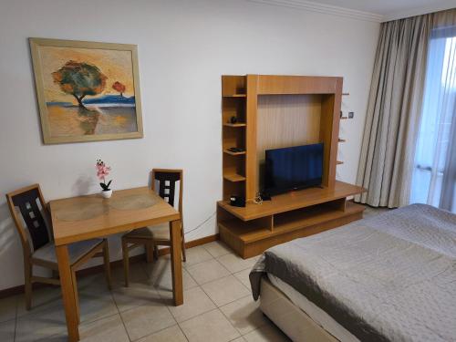 Postel nebo postele na pokoji v ubytování Emerald Apartman Wellness & Spa