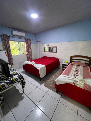 Postel nebo postele na pokoji v ubytování Pousada da Vovó