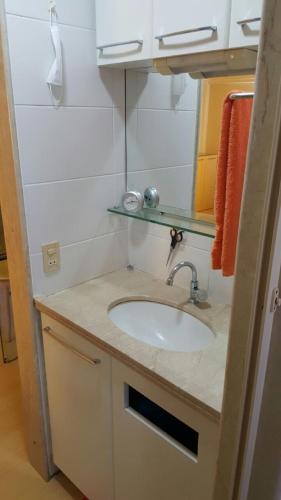 a bathroom counter with a sink in a room at Flat em Boa Viagem in Recife