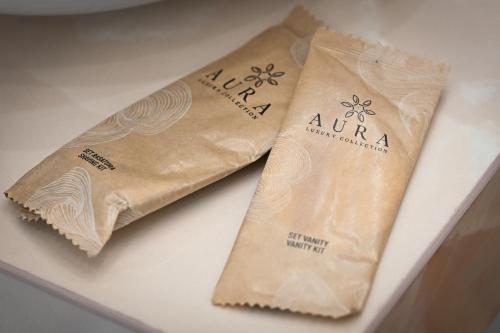 two brown bags sitting on a white table at Plaza Rooms Luxury B&B in Pagani