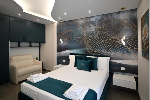 a hotel room with a bed and a chair at Plaza Rooms Luxury B&B in Pagani