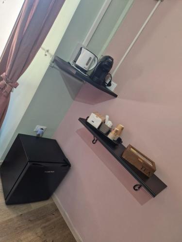 a room with two shelves on the wall at ITALO b&b in Raiano