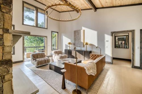 a living room with a couch and a table at Morgan Trail - Stunning Mountain Masterpiece in Epworth