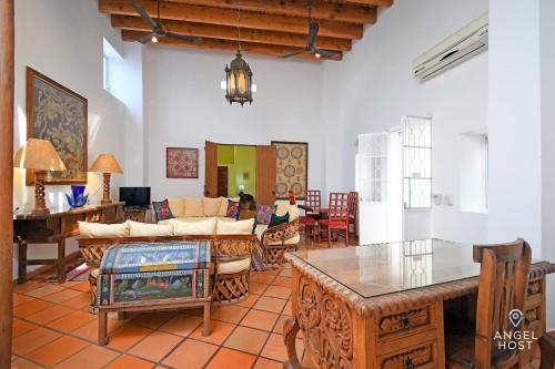 a living room with a couch and a table at Private pool, Oceanview Rooftop in Historic La Paz in La Paz